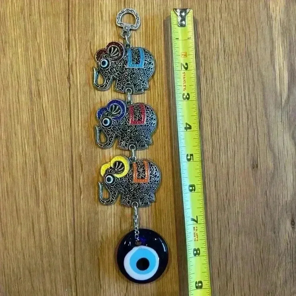 Evil Eye and Elephant wall pendant silver tone with glass evil eye.